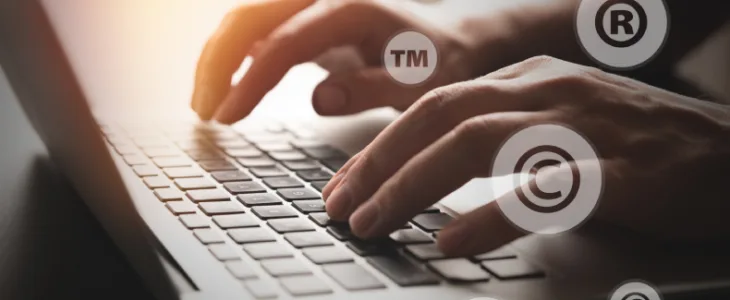 person typing on a laptop with different ip examples floating around