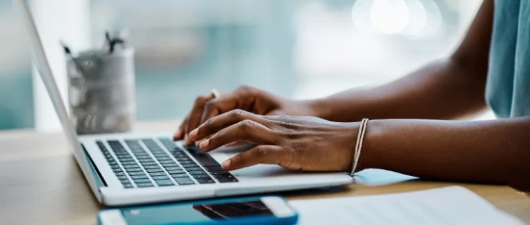 woman typing on her laptop contracts and negotiations