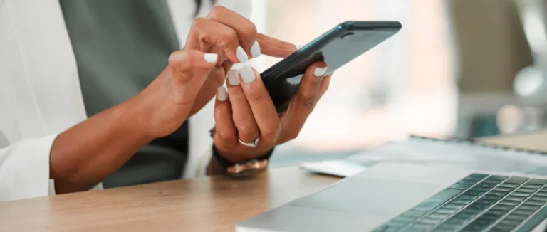 woman scrolling on her cellphone trade secrets