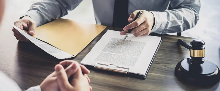 Business client sitting with attorney