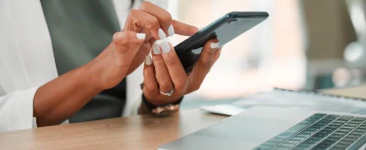 woman scrolling on her cellphone trade secrets