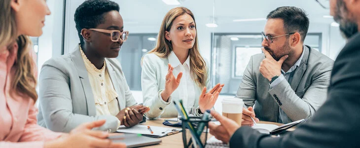 business owners sitting at conference room table